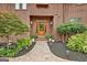 Charming home featuring a landscaped walkway leading to a wood door entrance at 4 & 5 Northlake Cir, Peachtree City, GA 30269