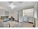 This room features a living area with an open laundry closet including a washer and dryer at 4 & 5 Northlake Cir, Peachtree City, GA 30269