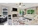 Bright living room boasts fireplace, ceiling fan, and neutral colors at 4 & 5 Northlake Cir, Peachtree City, GA 30269