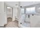 Elegant bathroom with a glass shower featuring tile walls and flooring, and a walk-in closet at 4 & 5 Northlake Cir, Peachtree City, GA 30269