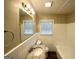 Traditional bathroom featuring a granite countertop and white tiled walls and shower at 4267 Lamar St, Decatur, GA 30035