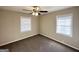 Cozy bedroom showcasing carpeted floors, neutral paint, and well-lit by dual windows at 4267 Lamar St, Decatur, GA 30035