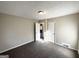 Neutral bedroom featuring carpeted floors and an attached bathroom providing ample space at 4267 Lamar St, Decatur, GA 30035