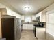 Bright kitchen boasts stainless steel appliances, granite countertops, and modern cabinetry at 4267 Lamar St, Decatur, GA 30035