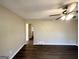 Spacious living room featuring wood floors and a ceiling fan with a light fixture at 4267 Lamar St, Decatur, GA 30035