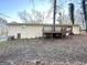 Backyard featuring a wooden deck and a beige house at 2017 Lindsey Ln, Decatur, GA 30035