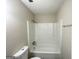 Standard bathroom with a tub, shower, toilet, and vanity for basic needs at 2017 Lindsey Ln, Decatur, GA 30035