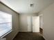 Comfortable bedroom with a large window, neutral walls, and plush carpet flooring at 2017 Lindsey Ln, Decatur, GA 30035