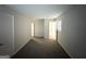 Neutral bedroom showcasing carpet flooring, a closet, and access to the bathroom at 2017 Lindsey Ln, Decatur, GA 30035