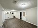 Finished basement with durable wood-look floors and access to stairs and an exterior door at 2317 Emerald Springs Dr, Decatur, GA 30035
