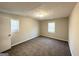 Spacious bedroom with carpet and two windows offering plenty of natural light at 2317 Emerald Springs Dr, Decatur, GA 30035