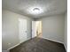 Bedroom with two closets, carpet, and a ceiling light at 2317 Emerald Springs Dr, Decatur, GA 30035