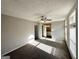 Sunlit bedroom with fan and view into bathroom, creates a bright and airy space at 2317 Emerald Springs Dr, Decatur, GA 30035