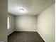 Cozy bedroom with plush carpeting, neutral walls, and a window for natural light at 2317 Emerald Springs Dr, Decatur, GA 30035