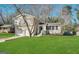 Charming two-story home with a well-maintained lawn, attached garage, and inviting front entrance at 2317 Emerald Springs Dr, Decatur, GA 30035