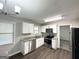 Updated kitchen with stainless steel appliances, granite countertops, and ample cabinet space at 2317 Emerald Springs Dr, Decatur, GA 30035