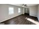 Inviting living room featuring new flooring, neutral walls, and bright windows at 2317 Emerald Springs Dr, Decatur, GA 30035