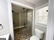 Bathroom featuring a large glass enclosed shower, tile floor and a window at 2676 Stone Rd, East Point, GA 30344