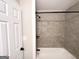 Bathroom with a new shower over tub combination and tiled surround at 2676 Stone Rd, East Point, GA 30344