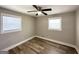 Bedroom with wood-look flooring and two windows allowing for natural light at 2676 Stone Rd, East Point, GA 30344
