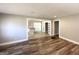 Open-concept living space with hardwood floors offering a seamless flow to the kitchen at 2676 Stone Rd, East Point, GA 30344
