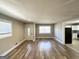 Inviting living room filled with natural light and hardwood floors, leading into the kitchen at 2676 Stone Rd, East Point, GA 30344