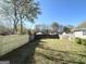 Large backyard featuring a well-maintained lawn and new wooden fence at 315 Breezy Hill Walk, Stockbridge, GA 30281