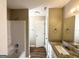 Bathroom featuring granite countertop, white cabinets, and shower-tub combo at 315 Breezy Hill Walk, Stockbridge, GA 30281