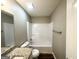 Bathroom with granite vanity and shower-tub, showcasing a clean and modern design at 315 Breezy Hill Walk, Stockbridge, GA 30281
