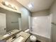 Bathroom featuring granite vanity and shower-tub, showcasing a clean and modern design at 315 Breezy Hill Walk, Stockbridge, GA 30281