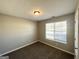 Bedroom with neutral walls, plush carpet, and bright window at 315 Breezy Hill Walk, Stockbridge, GA 30281
