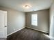 Bedroom with neutral walls and carpet, showcasing the bright window at 315 Breezy Hill Walk, Stockbridge, GA 30281
