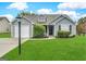 Charming single story home with a well-maintained lawn and attached one car garage at 315 Breezy Hill Walk, Stockbridge, GA 30281