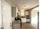 Bright kitchen with white cabinetry, granite countertops, and stainless steel appliances at 315 Breezy Hill Walk, Stockbridge, GA 30281