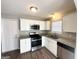 Well-equipped kitchen with stainless appliances, white cabinets, and granite countertops at 315 Breezy Hill Walk, Stockbridge, GA 30281
