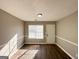 Versatile room with hardwood floors, a window, and neutral paint, perfect for office or guest room at 315 Breezy Hill Walk, Stockbridge, GA 30281