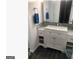 Bathroom featuring a vanity with marble countertops and ample storage at 3834 Kensingwood Trce, Decatur, GA 30032