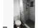 Bathroom featuring a toilet and a beautifully tiled shower with a rainfall showerhead at 3834 Kensingwood Trce, Decatur, GA 30032