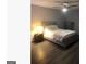 Bedroom featuring hardwood floors, neutral paint and trim, and a ceiling fan at 3834 Kensingwood Trce, Decatur, GA 30032