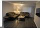 Cozy living room with comfortable seating, wood-look floors, and natural light at 3834 Kensingwood Trce, Decatur, GA 30032