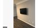 Living room featuring hardwood floors and a flatscreen television at 3834 Kensingwood Trce, Decatur, GA 30032