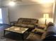 Inviting living room with neutral walls, comfortable furniture, and ample natural light at 3834 Kensingwood Trce, Decatur, GA 30032