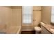 Neutral-toned bathroom featuring a bathtub and granite countertop at 710 Thomasville Se Blvd, Atlanta, GA 30315