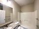 Well-maintained bathroom with granite countertop vanity and tub-shower combo providing a functional and clean space at 710 Thomasville Se Blvd, Atlanta, GA 30315