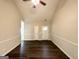 Open-concept living room features dark wood-look floors and neutral walls, creating a bright, inviting atmosphere at 710 Thomasville Se Blvd, Atlanta, GA 30315