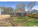 View of home's backyard featuring a wood fence and green grass at 1101 Oak Knoll Ter, Atlanta, GA 30315