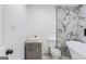 Bathroom with standalone tub and stylish gray vanity at 1101 Oak Knoll Ter, Atlanta, GA 30315