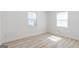 Light and airy bedroom with two windows and neutral walls at 1101 Oak Knoll Ter, Atlanta, GA 30315