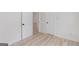 Bedroom with wood-look floors and doors to other rooms at 1101 Oak Knoll Ter, Atlanta, GA 30315