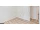 Neutral bedroom with wood-look floors and a white paneled door at 1101 Oak Knoll Ter, Atlanta, GA 30315